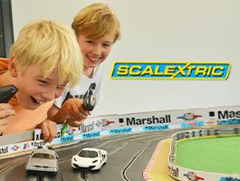 Kids playing on giant Scalextric